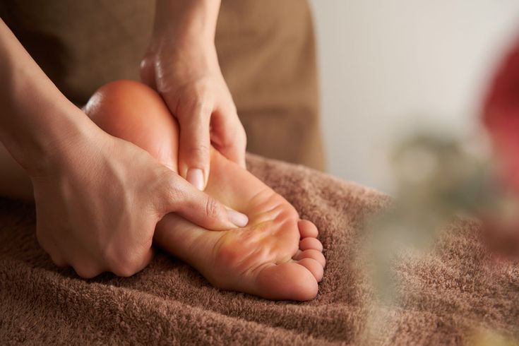 Home a,japanese,woman,receives,a,foot,massage,at,a,beauty